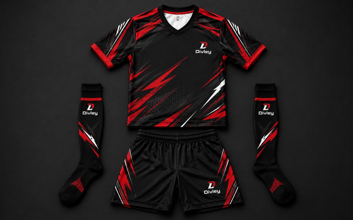 Fully custom black, red and white sublimated kit laid flat on a dark backdrop — jersey, shorts and matching long socks with Divley branding